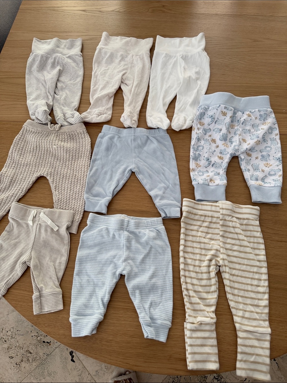 9 pairs of pants 1 newborn/ 6 3 month/ 1 1-3m/ 1 3-6m